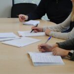 a few people sitting at a table